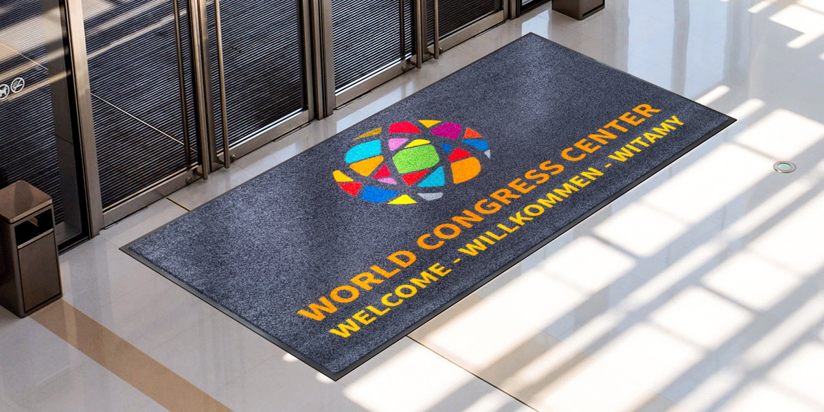 Jet-Print - grey Jet-Print mat with colourful elements in front of the door promoting the world congress center